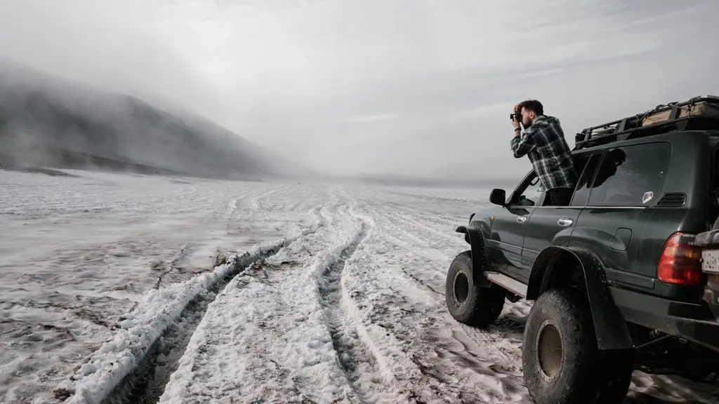 A Kuafo inflatable rooftop tent deployed on a 4x4 at golden hour