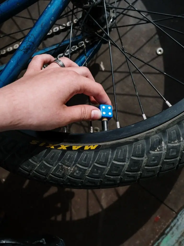 A camper activating the inflation valve on a Kuafo tent