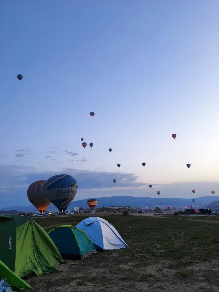 A Kuafo tent on a coastal bluff at blue hour